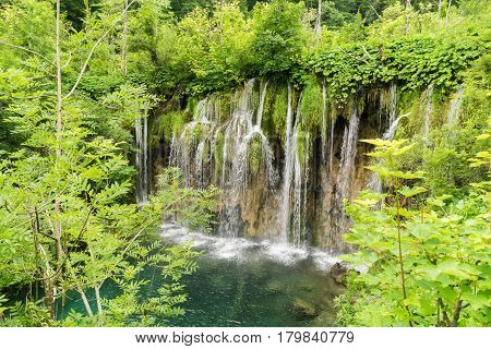View overlooking waterfalls cascading down the karst formations in Plitvice Lakes National Park near Entrance 1 on the H trail.