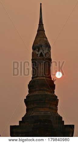 Sunset in Sukothai, Thailand
The sun sets behind one of the structures at Wat Mahathat Temple in Sukothai, a UNESCO Heritage Site in Thailand.