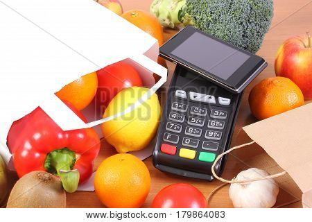Payment Terminal And Mobile Phone With Nfc Technology, Fruits And Vegetables, Cashless Paying For Sh