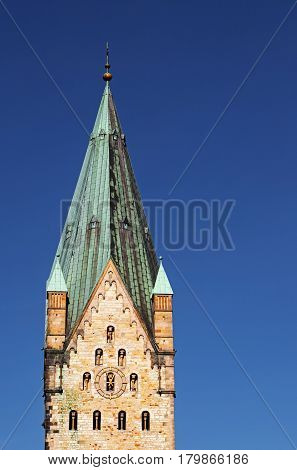 Paderborn church tower of the catholic Dom cathedral a historical landmark in the inner city in Germany blue sky and copy space