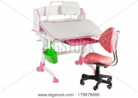 Pink chair pink school table green basket and desk lamp on the white isolated background.