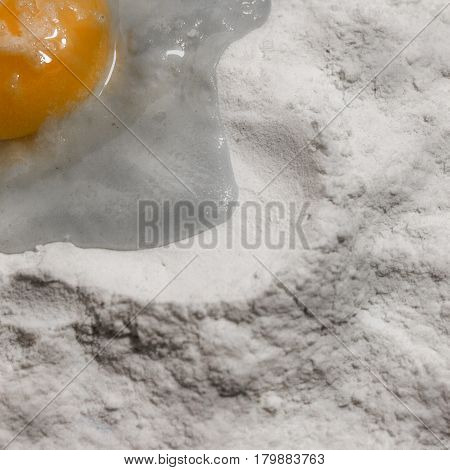 White flour and eggs yolk isolated on white background