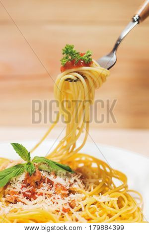 Close-up Of Asta Spaghetti With Tomato Sauce, Olives And Garnish. Italian Food.