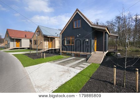 Street with wooden vacation houses in Reeuwijk in the Netherlands