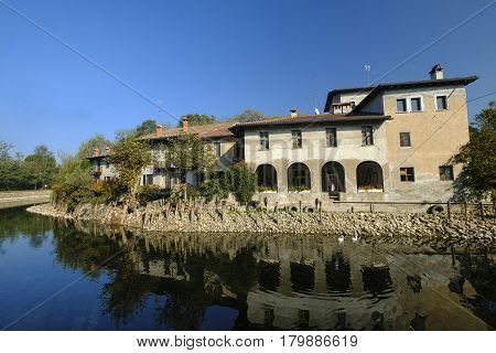 Country house along the Naviglio Grande of Turbigo (Milan Lombardy Italy) at fall with geese