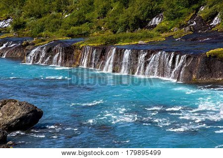 Hraunfossar Series Of Waterfalls Formed By Rivulets Streaming Over A Distance Of About 900 Metres