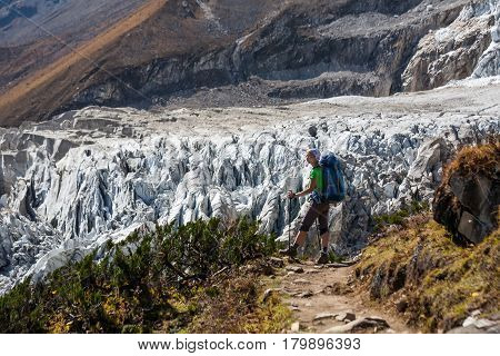 Trekker In Front Of Manaslu Glacier On Manaslu Circuit Trek In Nepal