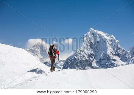 Trekker Is Walking By Renjo La Pass In Everest Region