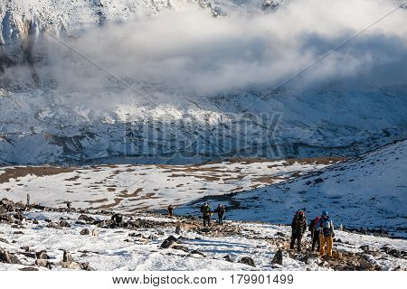 Trekker approaching PumoRi mountain in Khumbu valley on a way to Everest Base camp