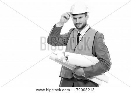 Concentrated on success. Black and white shot of a handsome male constructionist in a hardhat and safety vest on white background professionalism success development concept