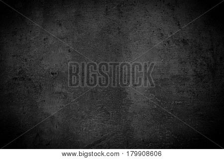 Black monochrome slate background. Empty black concrete stone surface texture.