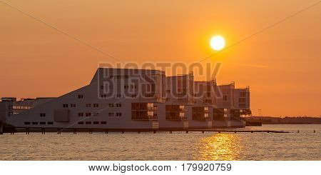 Contemporary Aluminum Housing at Gooimeer Netherlands under orange sun