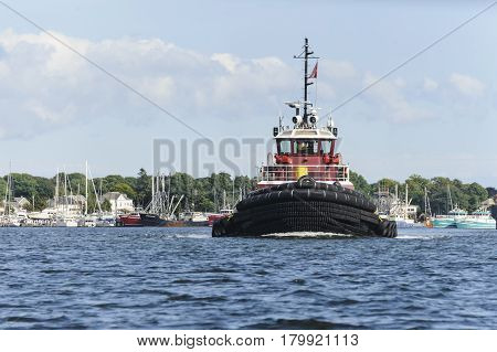 New Bedford Massachusetts USA - August 21 2014: Tug crossing Acushnet River inner harbor in New Bedford Massachusetts