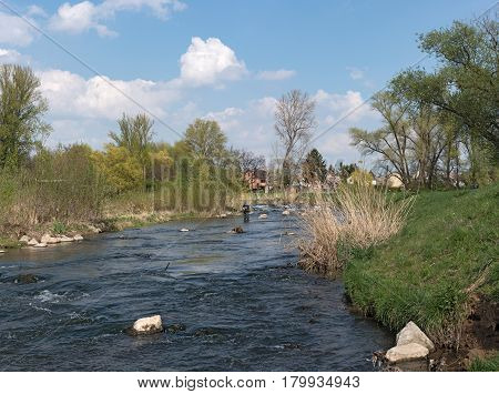 FRANKFURT, GERMANY-APRIL 04, 2017: Fly fishing in the renatured Nidda River