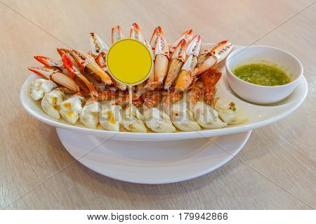Steamed Crab Legs Sea food background Boiled crab claws with orange sauce selective focus