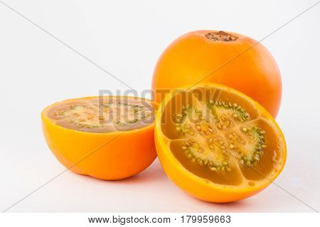 Lulo ( Solanum quitoense ) on white background