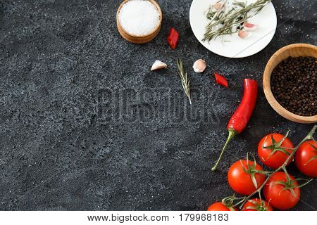 Composition of green and red vegetables on a dark background with space for text. Good for advertising posters and magazines.