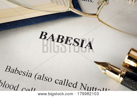 Page with title babesia on a table.