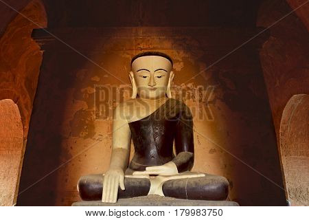 Ancient Buddha Statue Sitting In Meditation. Bagan, Myanmar.