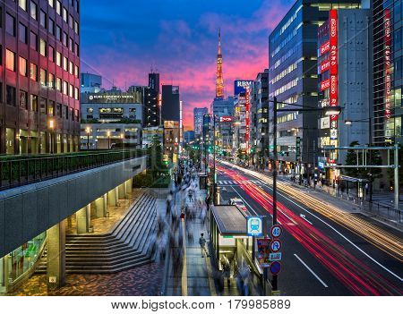 TOKYO JAPAN - JUNE 9 2015: Evening Rush Hour near Tokyo Tower Tokyo Japan. At 332.9 metres it is the second-tallest structure in Japan.