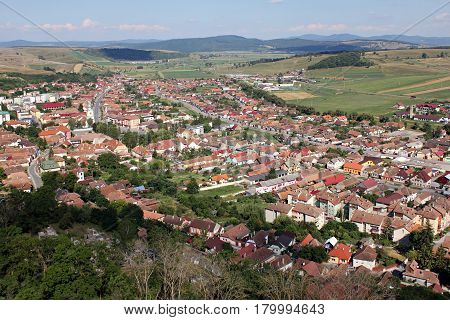 Top view of an village with the church in the center.