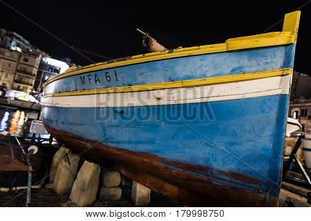 Boat On The Shore Of Spinola Bay, Malta
