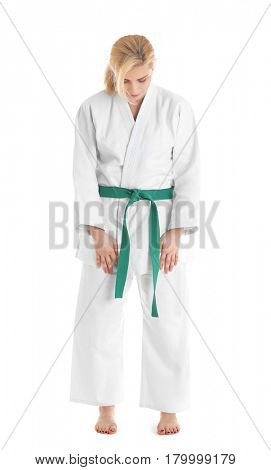 Young sporty woman in kimono on white background