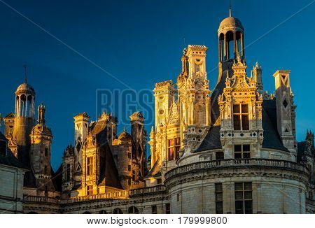 The royal Chateau de Chambord at sunset, France. This famous castle is located in the Loire Valley, was built in the 16th century and is one of the most recognizable chateaux in the world.