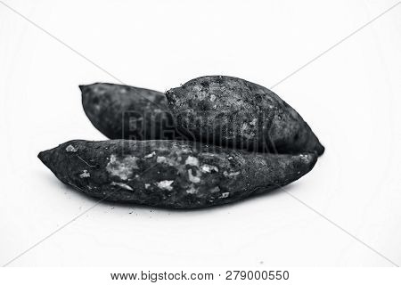 Close Up Of Raw Organic Sweet Potatoes Or Ipomoea Batatas Or  Shakarkandi   Isolated On White.