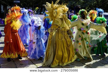 Modugno, Italy - February 4, 2018: Young People And Children With Beautiful And Colorful Clothes Dur