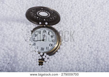 Retro Pocket Watch On White Polystyrene Balls