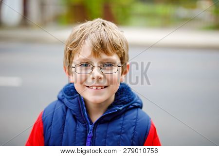 Portrait Of Little Kid Boy With Glasses In Colorful Fashion Fall Clothing. Happy Healthy Child Havin