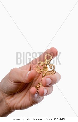 Hand Holding An Isolated Paper House With A White Background