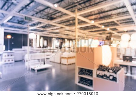 Blurry Background Variety Of Table, Ceiling, Floor Lamps At Furn