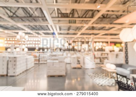 Blurry Background Variety Of Table, Ceiling, Floor Lamps At Furn