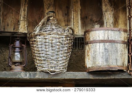 Authentic Demijohn And Old Wood Wine Barrel