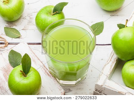 Glass Of Fresh Organic Apple Juice With Green Apples In Box On Wood Background.