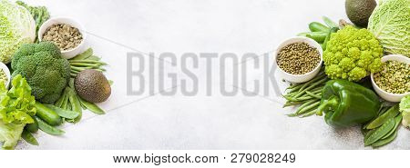 Assorted Green Toned Raw Organic Vegetables On White Background. Avocado, Cabbage, Broccoli, Caulifl