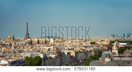 Paris Street With View On The Famous Paris Eiffel Tower On A Sunny Day With Some Sunshine