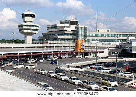 Berlin - Jun 1, 2016: Airport Tower And Taxi S In Front Of The Airport Terminal Of Berlin-tegel Airp