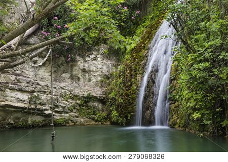 Waterfall Falling Into A  Lake. Bath Of Aphrodite. Cyprus. Tourist Destination, Tourist Attraction, 