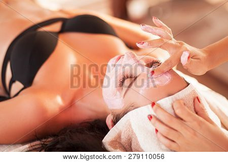 Spa Mask. Beautiful Woman Get Spa Mask On The Sunny Beach In Spa Salon Outdoor. High Quality. Scin C
