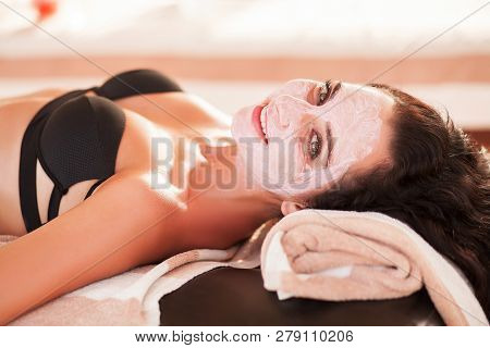 Spa Mask. Beautiful Woman Get Spa Mask On The Sunny Beach In Spa Salon Outdoor. High Quality. Scin C
