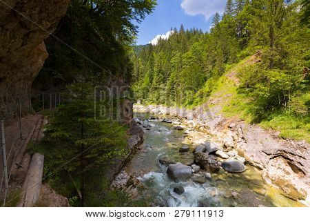 Hiking trail along Kaiserklamm canyon, Kaiser Gorge, beautiful narrow valley between rocky walls at Kaiserklamm in Brandenberg, Kramsach, Tyrol, Austria