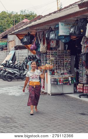 Bali, Indonesia - August 03 2015: A Woman Is Offering Sacrifice In Dempasar City At Bali, Indonesia