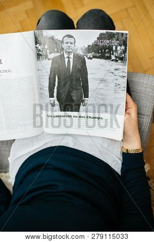 Paris, France - Jan 2, 2019: Vertical Image Of Woman Reading Article In M Le Magazine Du Monde With 