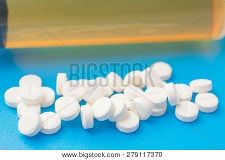 Pharmacetic Concept: Pills Top View On Blue Background