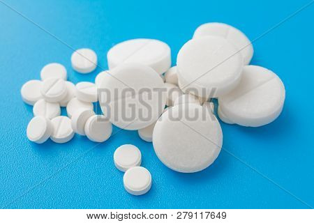 Pharmacetic Concept: Pills Top View On Blue Background