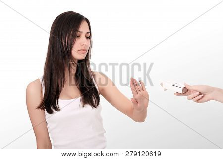 Healthy Young Woman Refusing To Take Cigarette From Pack. Portrait Of Beautiful Female Showing Stop 