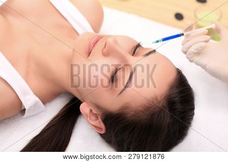 Woman Gets Injection In Her Face. Beauty Woman Giving Injections. Young Woman Gets Beauty Facial Inj